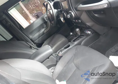 2016 Jeep Wrangler Unlimited Willys Wheeler z USA, uszkodzony, nr VIN 1C4BJWDG9GL233884